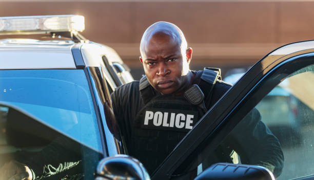 istock Stern African-American policeman looking at camera 1428169266