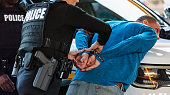 Policewoman and partner arresting man