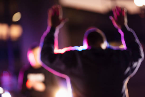 Man surrendering to police at night stock photo