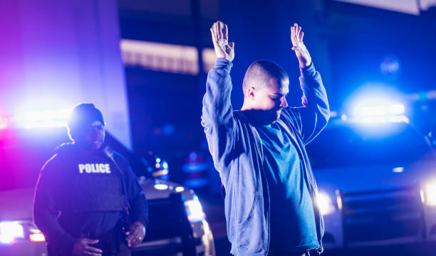 istock Man surrendering to police at night 1428171606