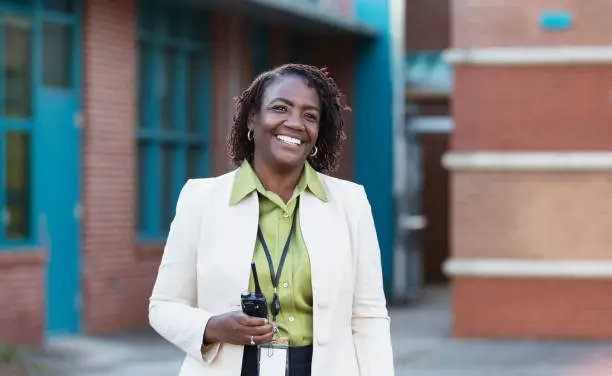 Photo of African-American teacher or principal outside school