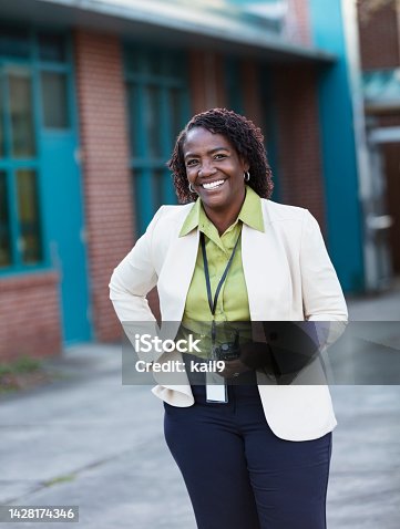 istock African-American teacher or principal outside school 1428174346
