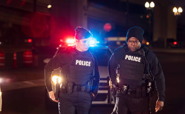istock Two police officers responding to call at night 1428178256