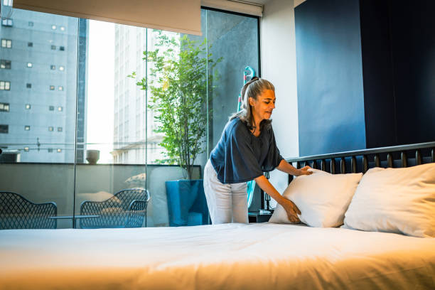 istock A latin woman making her bed at home 1428184882