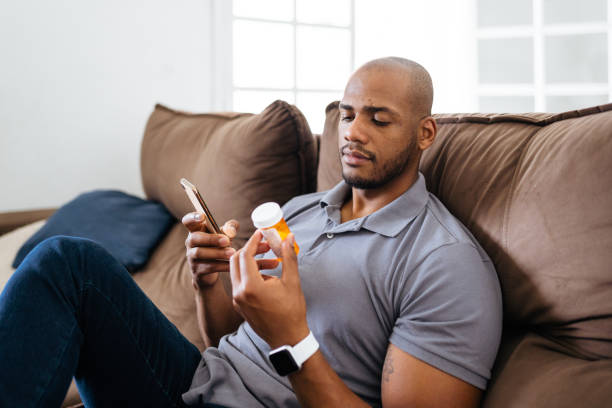 istock Man checking medicine on smartphone 1428189664