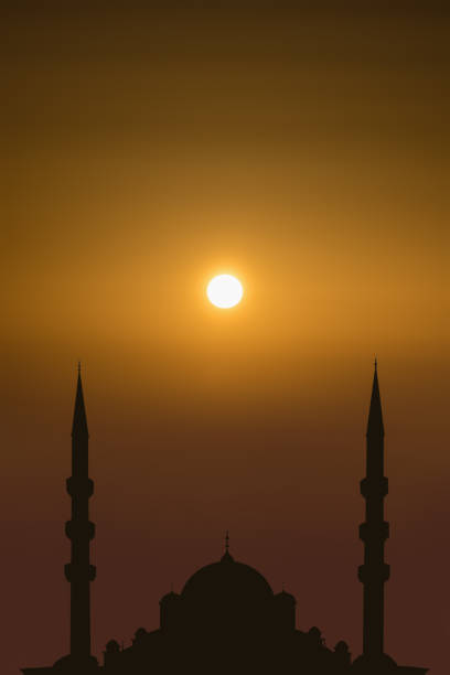istock silhouette islamic mosque on sunrise sky background 1428189677