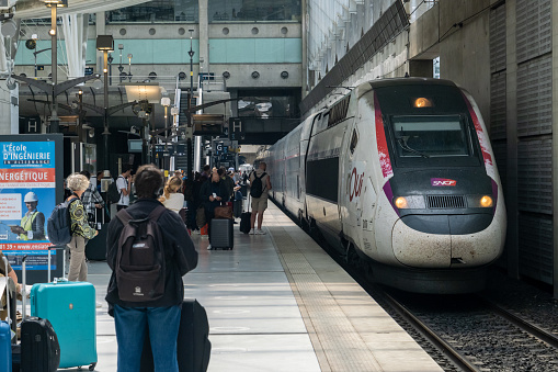 Roissy-en-France, France - 27 June 2022: TGV high-speed train entering station at Paris-CDG airport