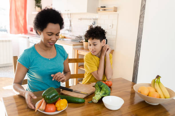istock Boy learning from his mother about healthy eating 1428190689
