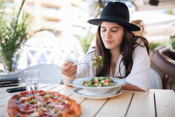 istock Woman eating a salad. 1428193484