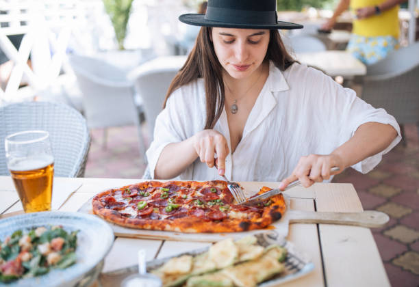 istock Enjoying a delicious pizza at italian restaurant. 1428193490