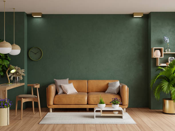 camera luminosa con divano in pelle e sala decorazione su sfondo vuoto verde scuro. - armchair sofa leather brown foto e immagini stock