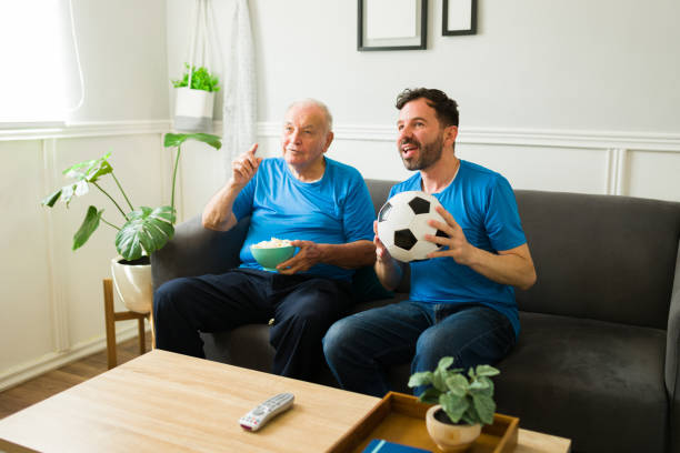 istock Excited elderly father and son watching a soccer game together 1428204419
