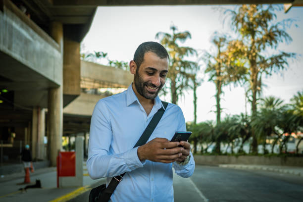 istock Lebanese man using cellphone in the street 1428205372