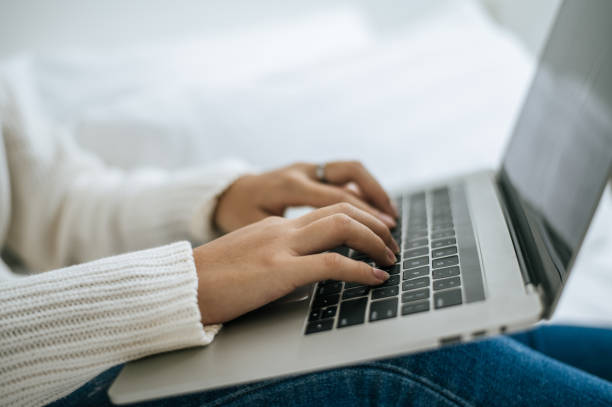 istock The hand that is put on the laptop. 1428220863