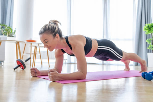istock Fit woman in a plank position 1428225657