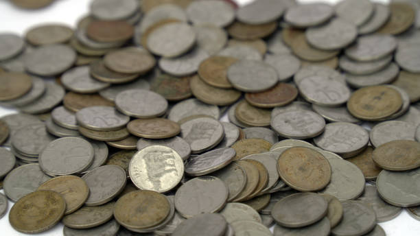 istock Pile of money (indian coin ) isolated on white background 1428225806
