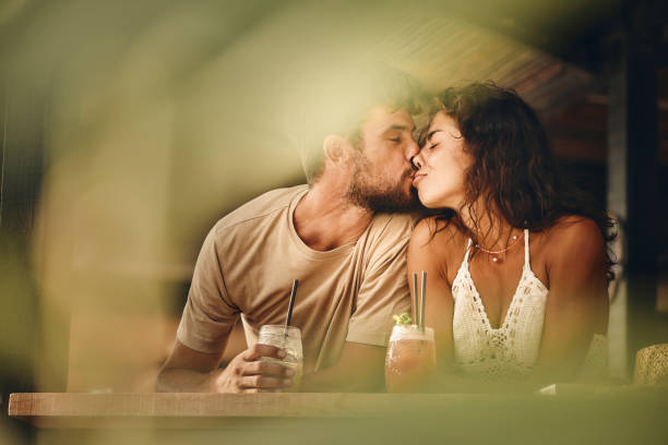 istock Affectionate couple kissing in a bar. 1428226076
