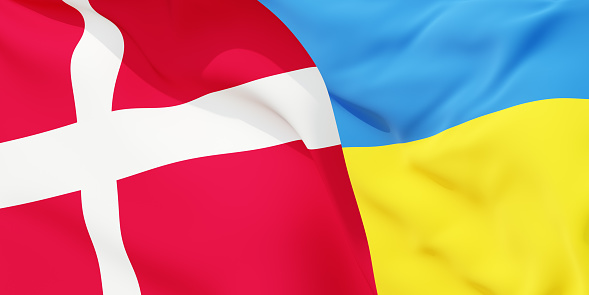 Danish and Ukrainian flags flying in the wind. Denmark stand with Ukraine. 3D rendered image.