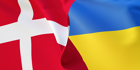 Danish and Ukrainian flags flying in the wind. Denmark stand with Ukraine. 3D rendered image.