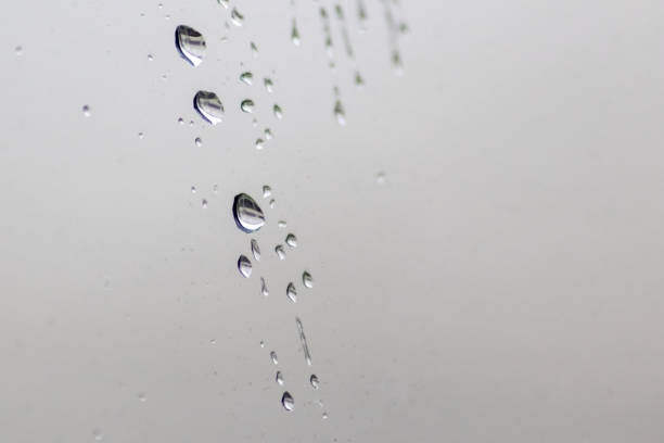 istock Rainy day raindrops on window as relaxing background texture for autumn and fall season shows rain and water droplets splashing on window surface with rainy weather texture in depression mood 1428227084