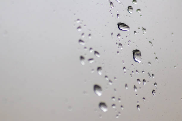 istock Rainy day raindrops on window as relaxing background texture for autumn and fall season shows rain and water droplets splashing on window surface with rainy weather texture in depression mood 1428227096