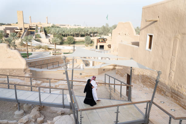 istock Local couple in traditional attire visiting Diriyah ruins 1428228613