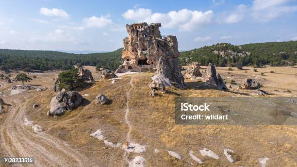 Aerial Drone View Of Beautiful Traveller Girl Is Walking To Doganli Castle In The Phrygian Valley In Phrygia Turkey Stock Photo - Download Image Now