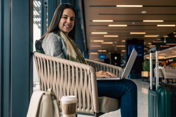 istock Woman at an airport using a laptop 1428233974