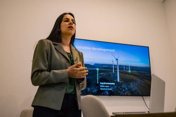 istock Woman presenting wind energy projects at a meeting 1428234024