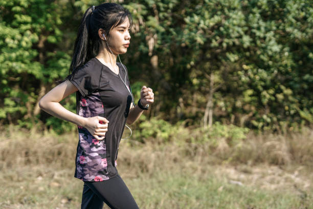istock women exercise by running on the road. 1428234774