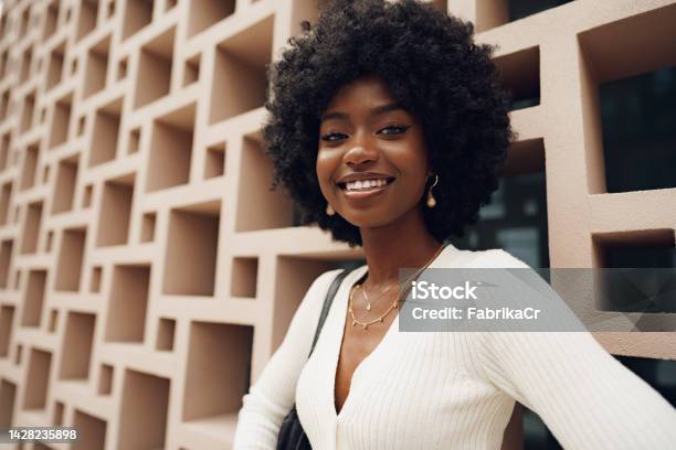 Stylish Pretty African Woman With Afro Hairstyle Posing Near Geometric Wall Stock Photo - Download Image Now
