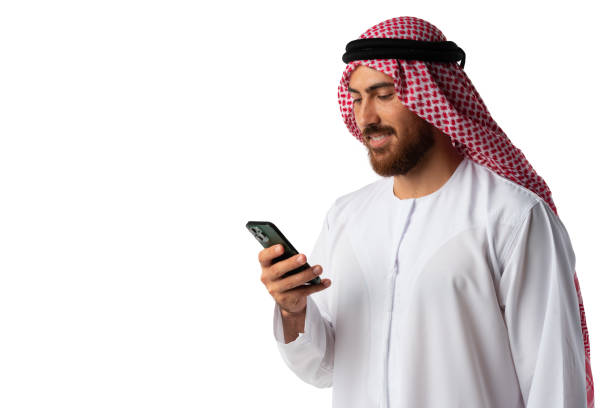 istock Young Arab businessman using smartphone isolated on white background 1428235902