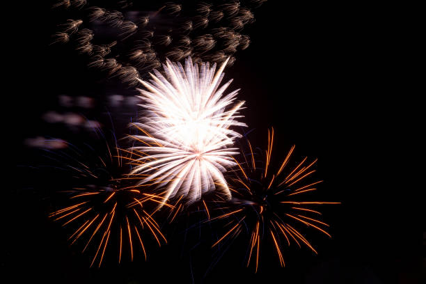 istock Festive fireworks. Bright beams of exploding pyrotechnics against black night sky. 1428236745