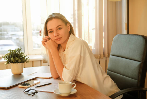 istock Woman on remote work or online education, using tablet computer, papers and notes, indoors at office or home at daytime. Remote teaching on learning courses for new profession or getting new skills 1428241032
