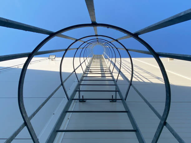 istock Low angle view of metallic ladder against blue sky 1428244443