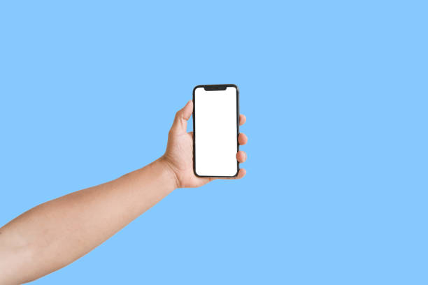 istock A pair of hands are playing with their phones 1428245814