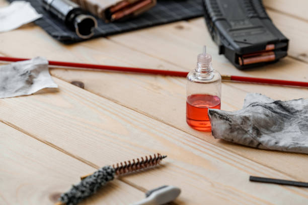 istock Disassembled rifle with cleaning tools on table of weapons workshop 1428247966