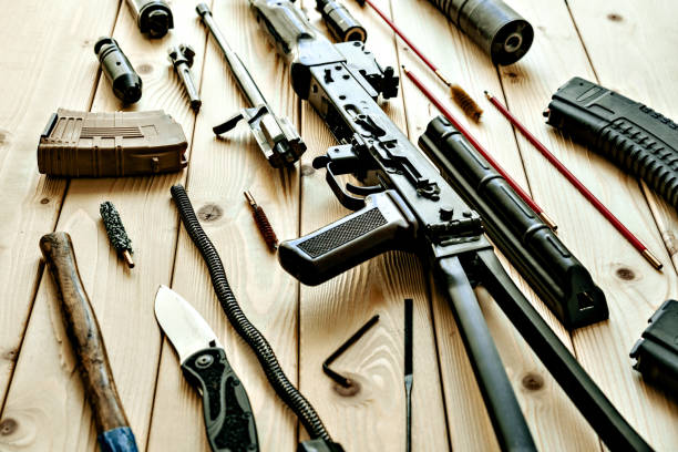istock Disassembled rifle with cleaning tools on table of weapons workshop 1428248037