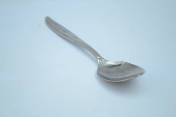 istock Silver spoon on isolated white background. Silver spoon is a kitchen and dining accessories during cooking and dining time 1428249614
