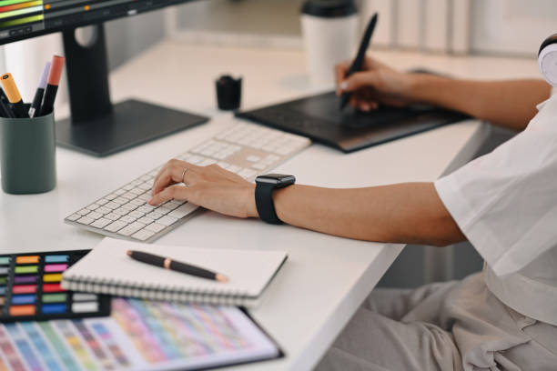 istock Cropped view of young creative woman using graphic tablet, working for design project at home office. 1428249776