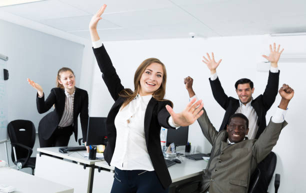 istock Delighted businesswoman with team 1428251652