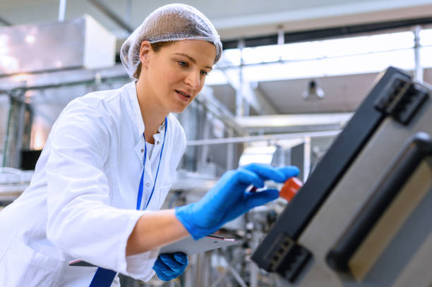 istock Female engineer working on maintenance in bottling plant 1428254543