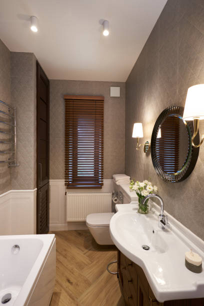 istock Modern Bathroom interior with stone wall, mirror and shower. 1428258049