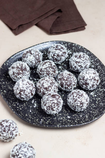 istock Coconut chocolate balls. Candy. Dessert. Vegetarian food. 1428258108