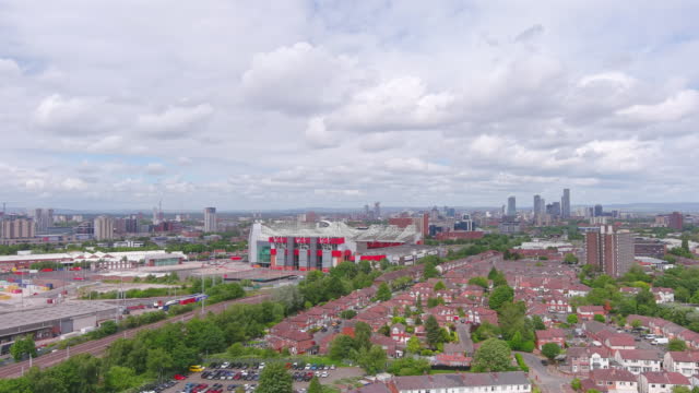 Manchester, UK: Aerial view of city in England, skyline of financial district with high-rise buildings - landscape panorama of United Kingdom from above