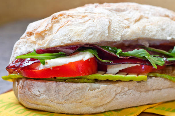 sandwich with mozzarella, tomato and bresaola - mozzarella tomato sandwich picnic imagens e fotografias de stock