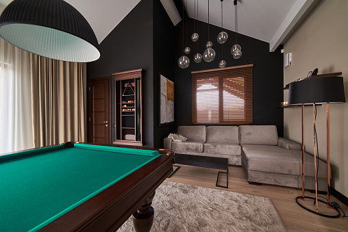 modern billiard room with a beautiful table and large windows, nobody