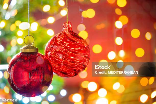 Christmas Fir Tree Background With Baubles And Glowing Christmas Stock Photo - Download Image Now