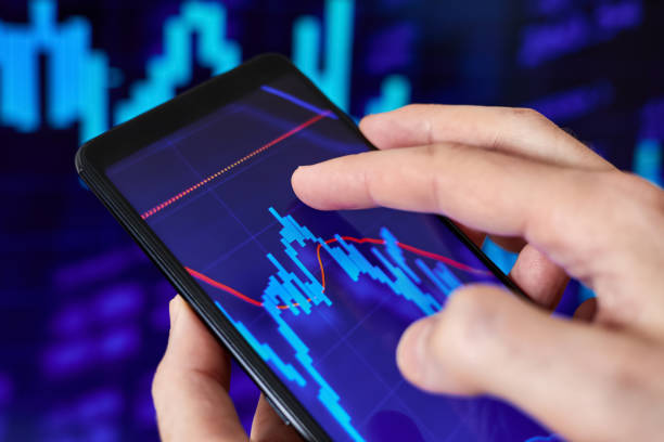 istock Trader analyzes stock market data in smartphone 1428270524