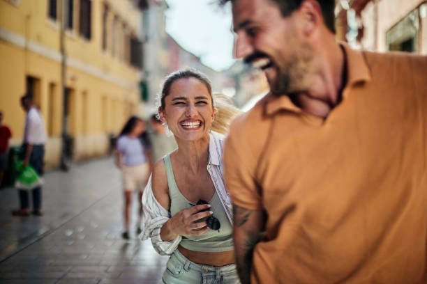 istock Cheerful couple having fun on the street. 1428270721